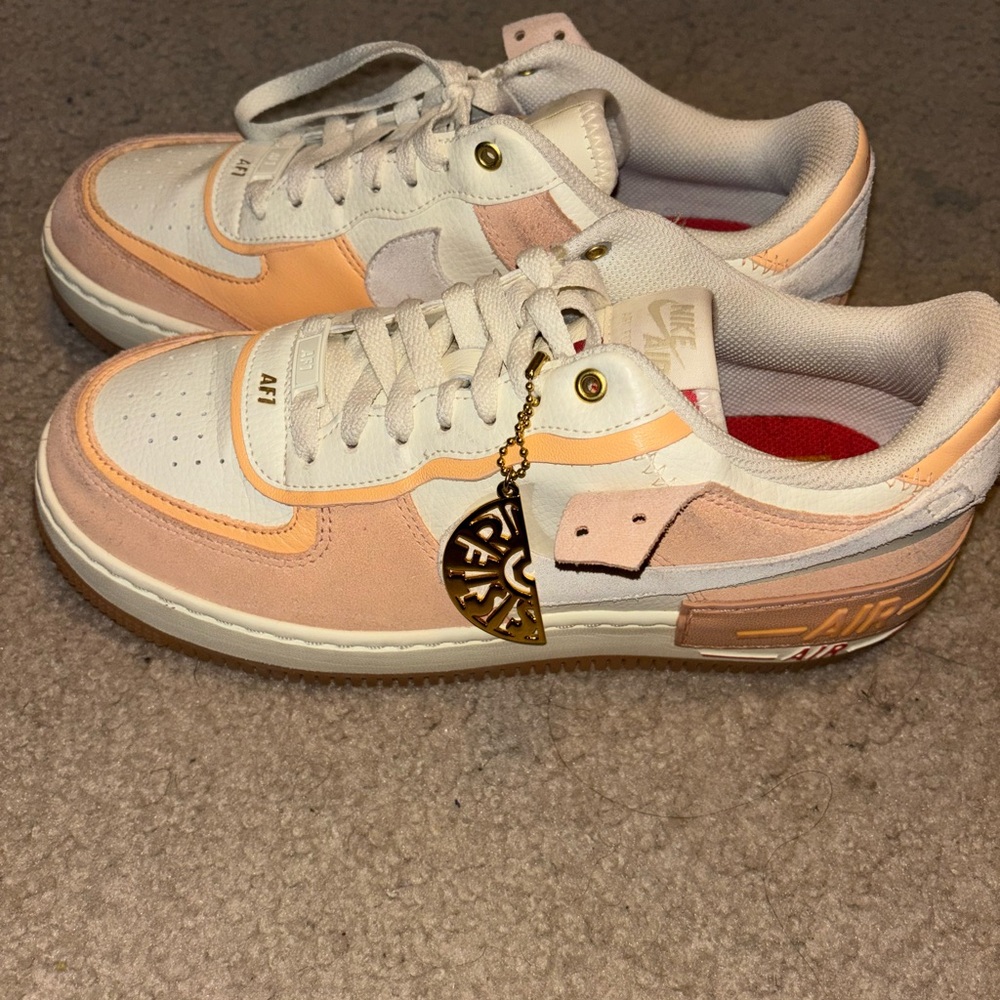 Nike White Sneakers with Low-Top Silhouette and Classic Design